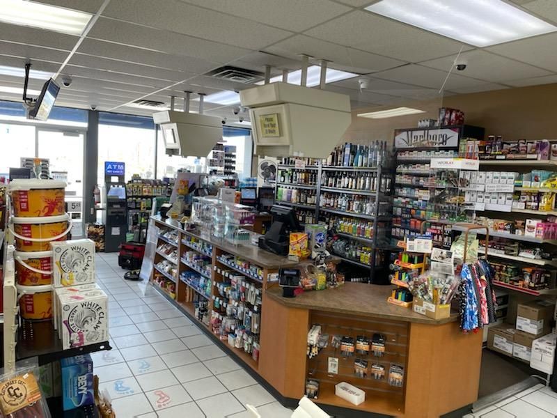 Custom convenience store fixture by Creative Display Works for Manny's Chevron